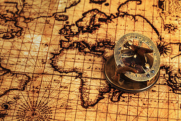 Image showing Old vintage compass on ancient map