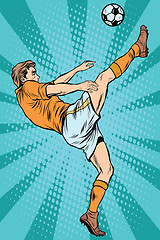 Image showing Football soccer player kick the ball