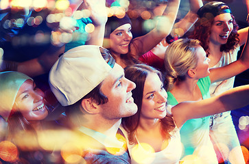 Image showing smiling friends at concert in club