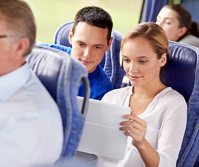 Image showing happy couple with tablet pc in travel bus