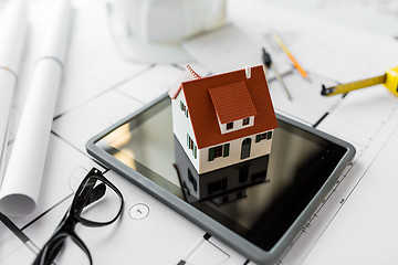 Image showing close up of living house model on tablet pc