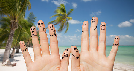 Image showing close up of hands and fingers with smiley faces