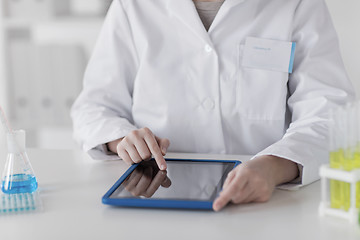 Image showing close up of scientist with tablet pc in lab