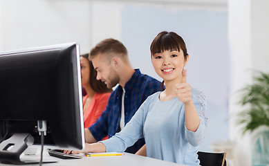 Image showing happy creative team or students working at office