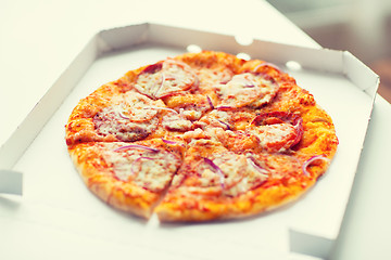 Image showing close up of pizza in paper box on table