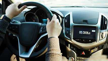 Image showing Close-up Of A Man Hands Holding Steering Wheel While Driving Car
