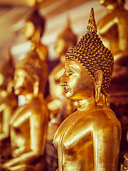 Image showing Golden Buddha statues in buddhist temple