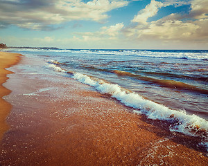 Image showing Wave surging on sand