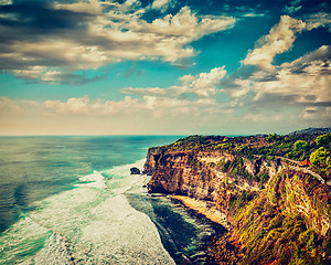 Image showing Cliff in ocean on sunset