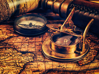 Image showing Old vintage compass on ancient map