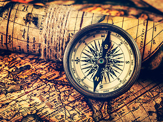 Image showing Old vintage compass on ancient map