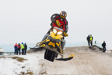 Image showing Sportsman jump on snowmobile