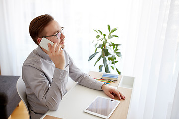 Image showing creative male worker calling on smarphone