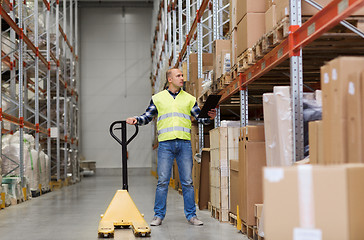 Image showing man with loader and clipboard at warehouse