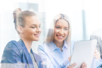 Image showing business team with tablet pc having discussion