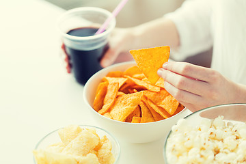 Image showing close up of woman with junk food and coca cola cup