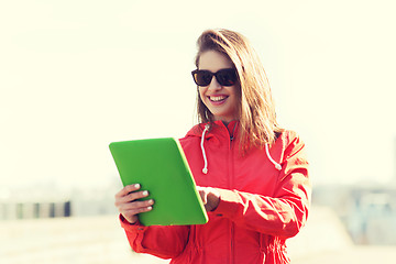 Image showing happy young woman or teenage girl with tablet pc