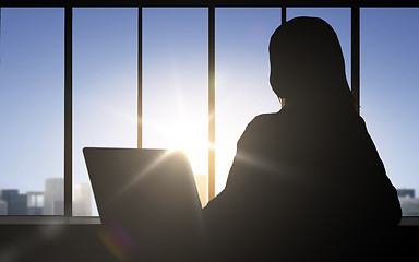 Image showing silhouette of business woman with laptop