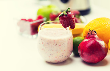 Image showing close up of glass with milk shake and fruits