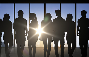 Image showing people silhouettes over office background