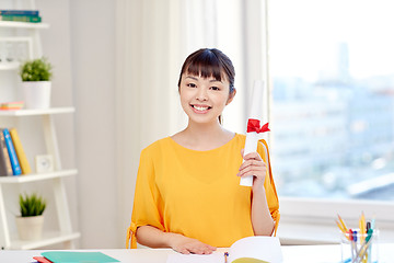 Image showing happy asian woman student with diploma at home