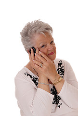 Image showing Senior woman talking on her cell phone.