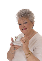 Image showing Senior woman holding coffee cup.