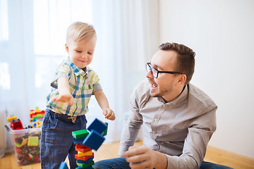 Image showing father and son playing with toy blocks at home