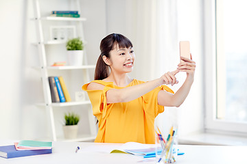 Image showing asian woman student taking selfie with smartphone