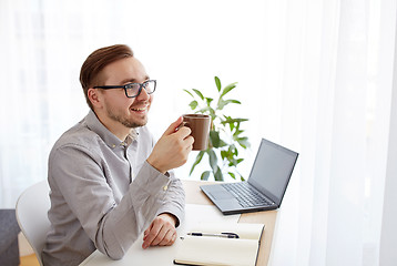 Image showing creative man or businessman drinking coffee