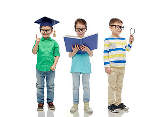 Image showing kids in glasses with book, lens and bachelor hat