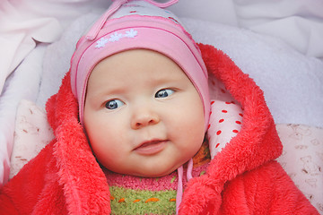 Image showing little baby smiling in the perambulator