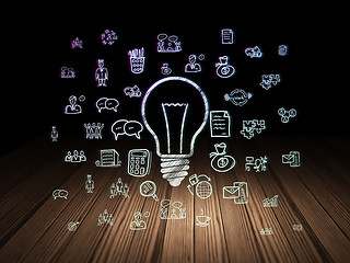 Image showing Business concept: Light Bulb in grunge dark room