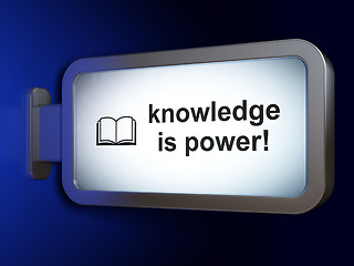 Image showing Learning concept: Knowledge Is power! and Book on billboard background