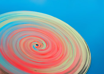 Image showing Painted colorful disc on a blue background