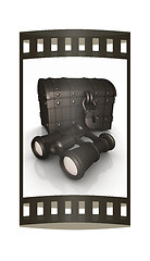 Image showing binoculars and chest. The film strip