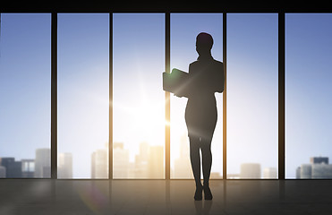 Image showing silhouette of business woman with folders