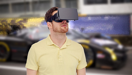 Image showing man in virtual reality headset and car racing game