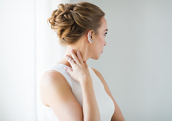 Image showing close up of beautiful woman with ring and earring