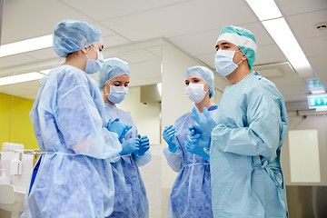 Image showing group of surgeons in operating room at hospital