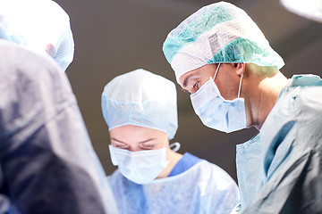 Image showing group of surgeons in operating room at hospital