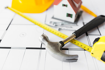 Image showing close up of house blueprint with building tools