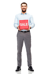 Image showing smiling man with red shopping bag