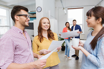 Image showing creative team on coffee break talking at office