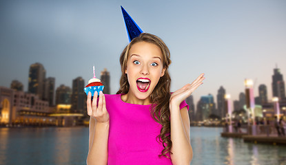 Image showing happy woman or teen girl with birthday cupcake