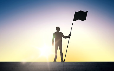 Image showing silhouette of businessman with flag over sun light