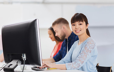 Image showing happy creative team or students working at office