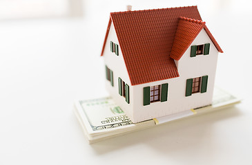 Image showing close up of home or house model and money