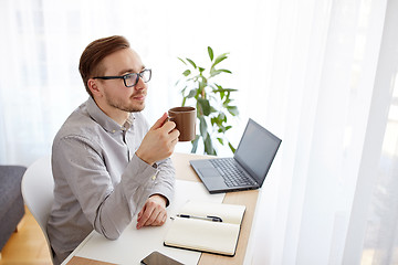 Image showing creative man or businessman drinking coffee