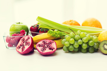 Image showing close up of fresh fruits and berries on table